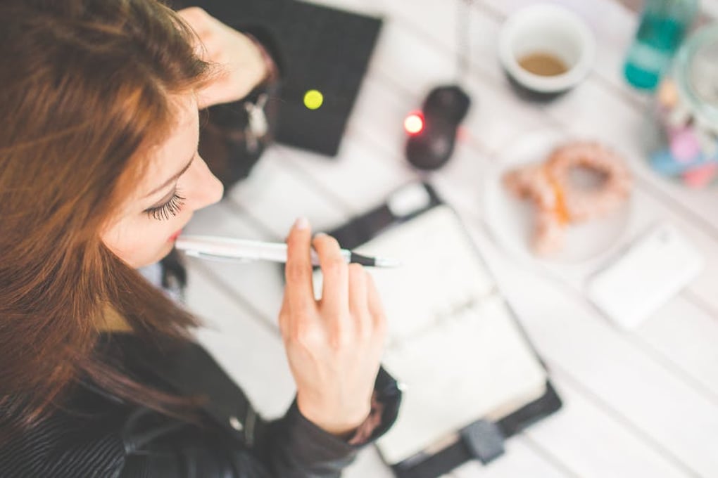 10 Unhealthy Habits You Developed First Semester That Need to Stop Second Semester 1 woman hand desk office
