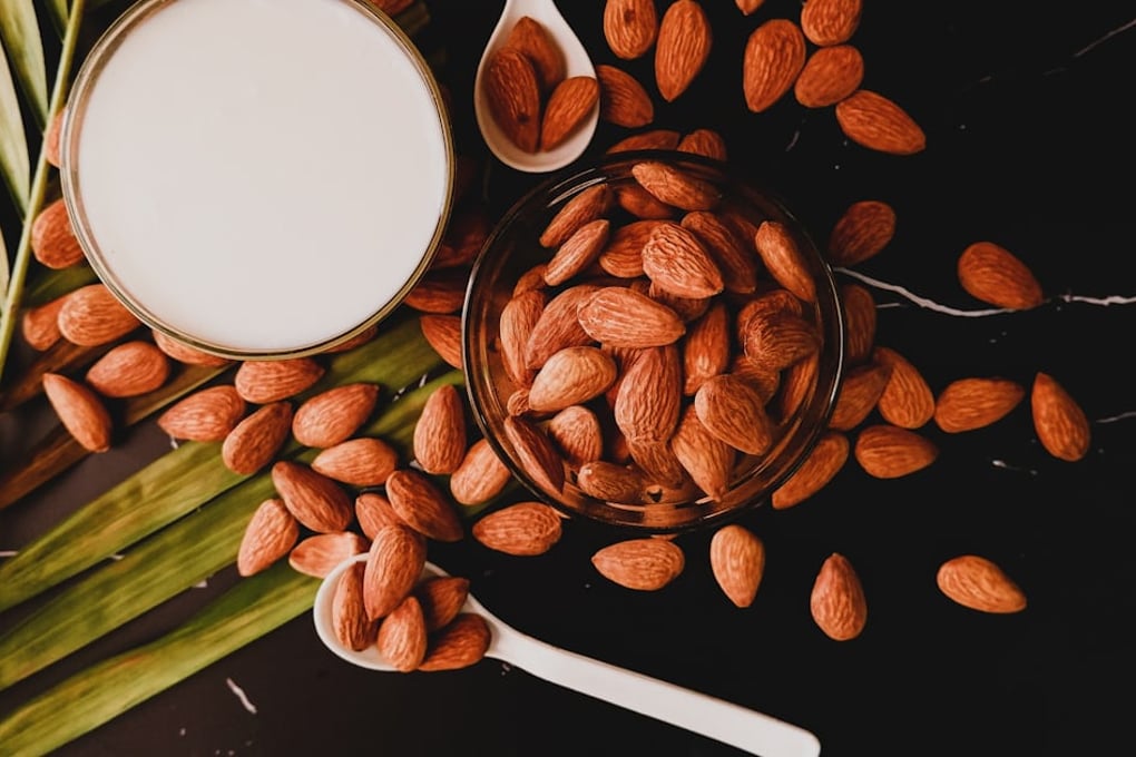 What's The Better Plant-Based Milk: Almond Milk or Oat Milk? 1 photo 1626196340104 2d6769a08761?crop=faces%2Cedges&cs=tinysrgb&fit=crop&fm=jpg&ixid=MnwxMjA3fDB8MXxhbGx8fHx8fHx8fHwxNjQ3NTYwNTY4&ixlib=rb 1.2.1&q=60&w=1200&auto=format&h=630&mark w=64&mark align=top%2Cleft&mark pad=50&blend mode=normal&blend alpha=10&blend w=1&mark=https%3A%2F%2Fimages.unsplash.com%2Fopengraph%2Flogo