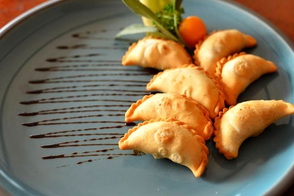 Gujiya with Pomegranate reduction