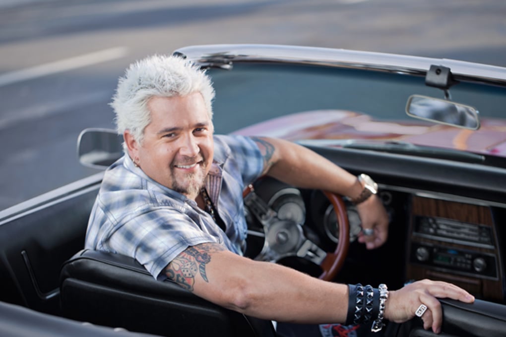 Guy Fieri 2011 Guy FIeri sitting in his convertible
