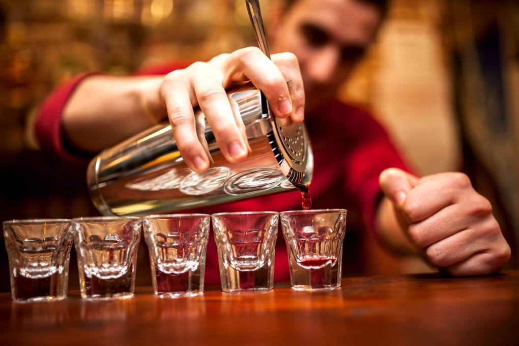 bartender pouring shots