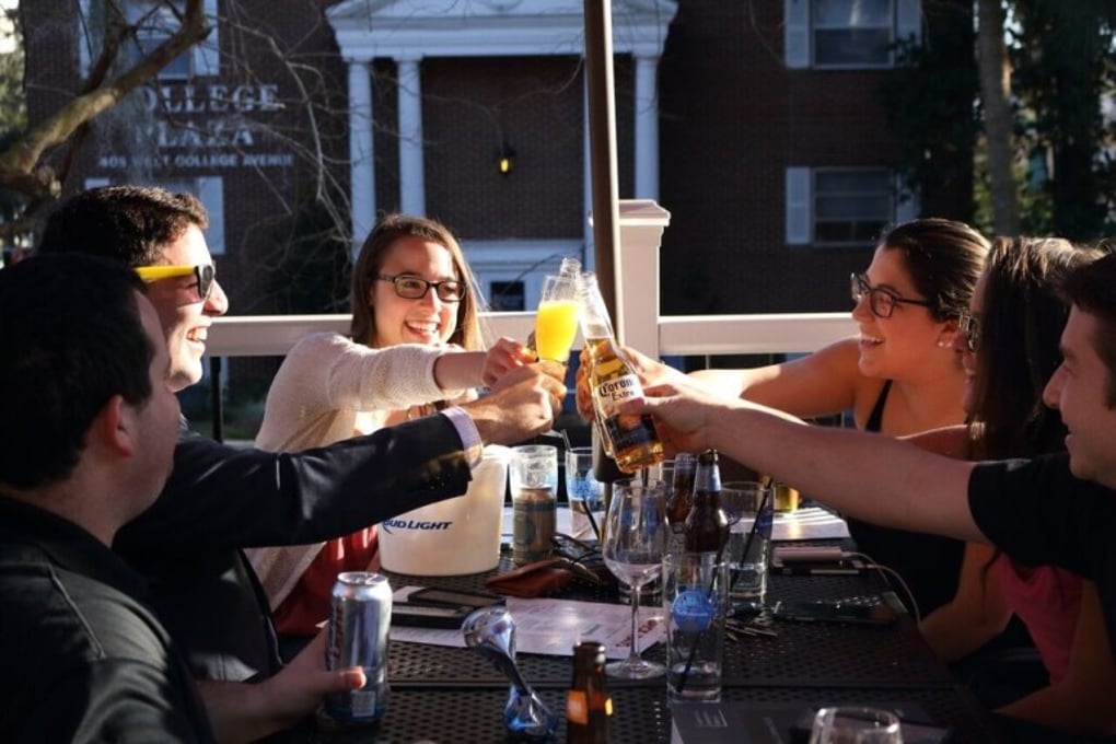 Photo of Friends Toasting at Brick Haus Pizza e1460576961688