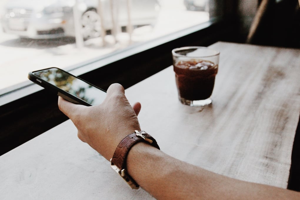 phone in hand coffee sightglasscoffee2 amycho