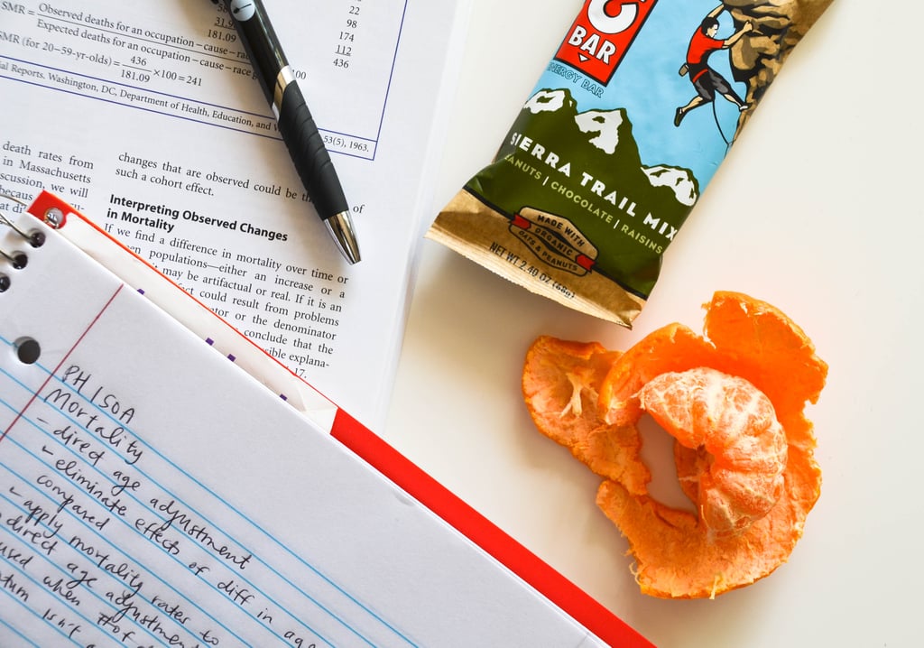 notes, textbook, study snack, snacks, studying, clif bar, tangerine, cutie
