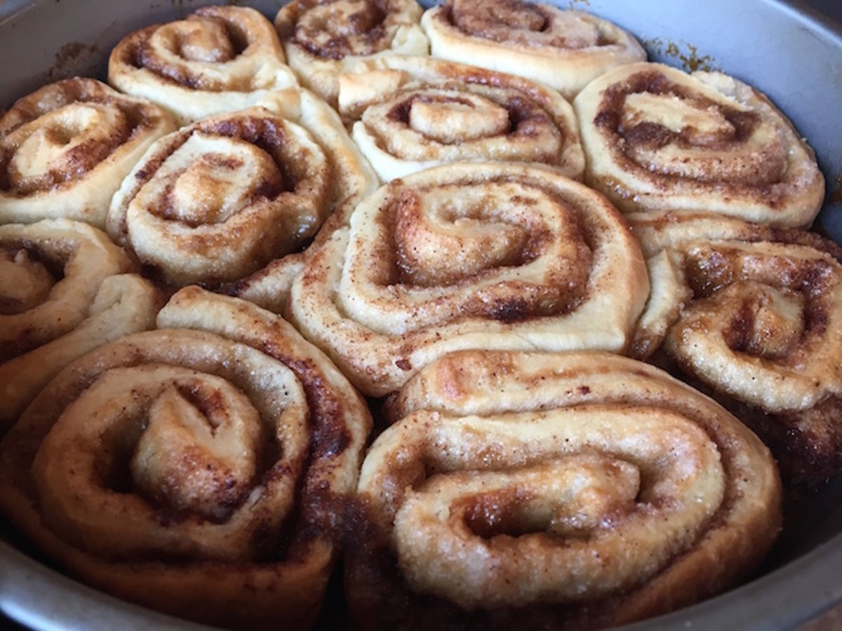 We want exactly two rolls to be greater than 4. The number of ways to choose which two of the three rolls are greater than 4 is: