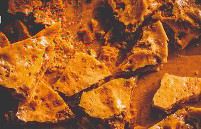 What Is Toffee? What to Know About This Sweet Treat 2 photo 1633964913707 0bed7de47021?crop=faces%2Cedges&cs=tinysrgb&fit=crop&fm=jpg&ixid=MnwxMjA3fDB8MXxhbGx8fHx8fHx8fHwxNjY2NjI3MDY1&ixlib=rb 4.0.3&q=60&w=1200&auto=format&h=630&mark w=64&mark align=top%2Cleft&mark pad=50&blend mode=normal&blend alpha=10&blend w=1&mark=https%3A%2F%2Fimages.unsplash.com%2Fopengraph%2Flogo