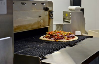Pizza going into toaster