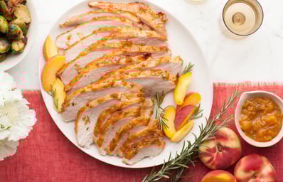 thanksgiving meal turkey nectarine meat slices ceramic plate food sauce