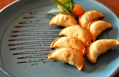 Gujiya with Pomegranate reduction
