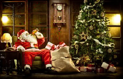 Santa drinking by the Christmas tree e1449821108677