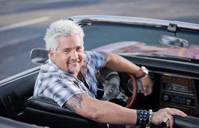 Guy Fieri 2011 Guy FIeri sitting in his convertible