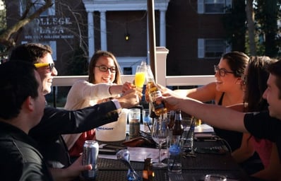 Photo of Friends Toasting at Brick Haus Pizza e1460576961688