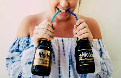 girl drinking beer with straw