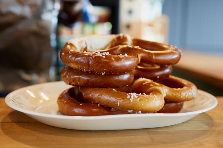 Willkommen to Squabisch Pretzels: Berkeley's Twist on German Pretzels 4 photo 1607103058027 4c5b42b86a60?crop=faces%2Cedges&cs=tinysrgb&fit=crop&fm=jpg&ixid=MnwxMjA3fDB8MXxhbGx8fHx8fHx8fHwxNjUxNzgyMzEy&ixlib=rb 1.2.1&q=60&w=1200&auto=format&h=630&mark w=64&mark align=top%2Cleft&mark pad=50&blend mode=normal&blend alpha=10&blend w=1&mark=https%3A%2F%2Fimages.unsplash.com%2Fopengraph%2Flogo
