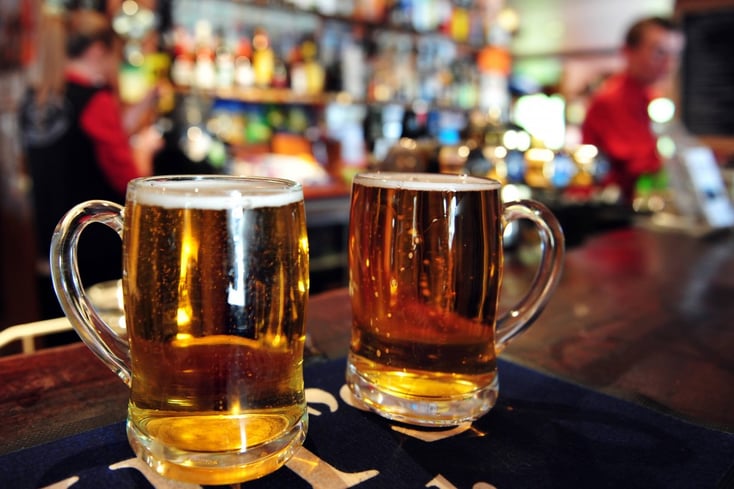Two cups of beer in bar