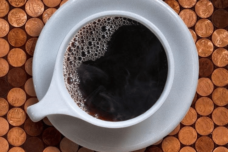 black coffee pennies spoon