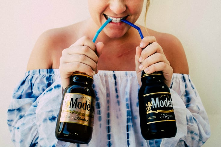 girl drinking beer with straw