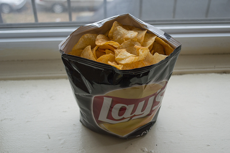 Make your chip bag stand up on itself by inverting the bottom and rolling it up a few times