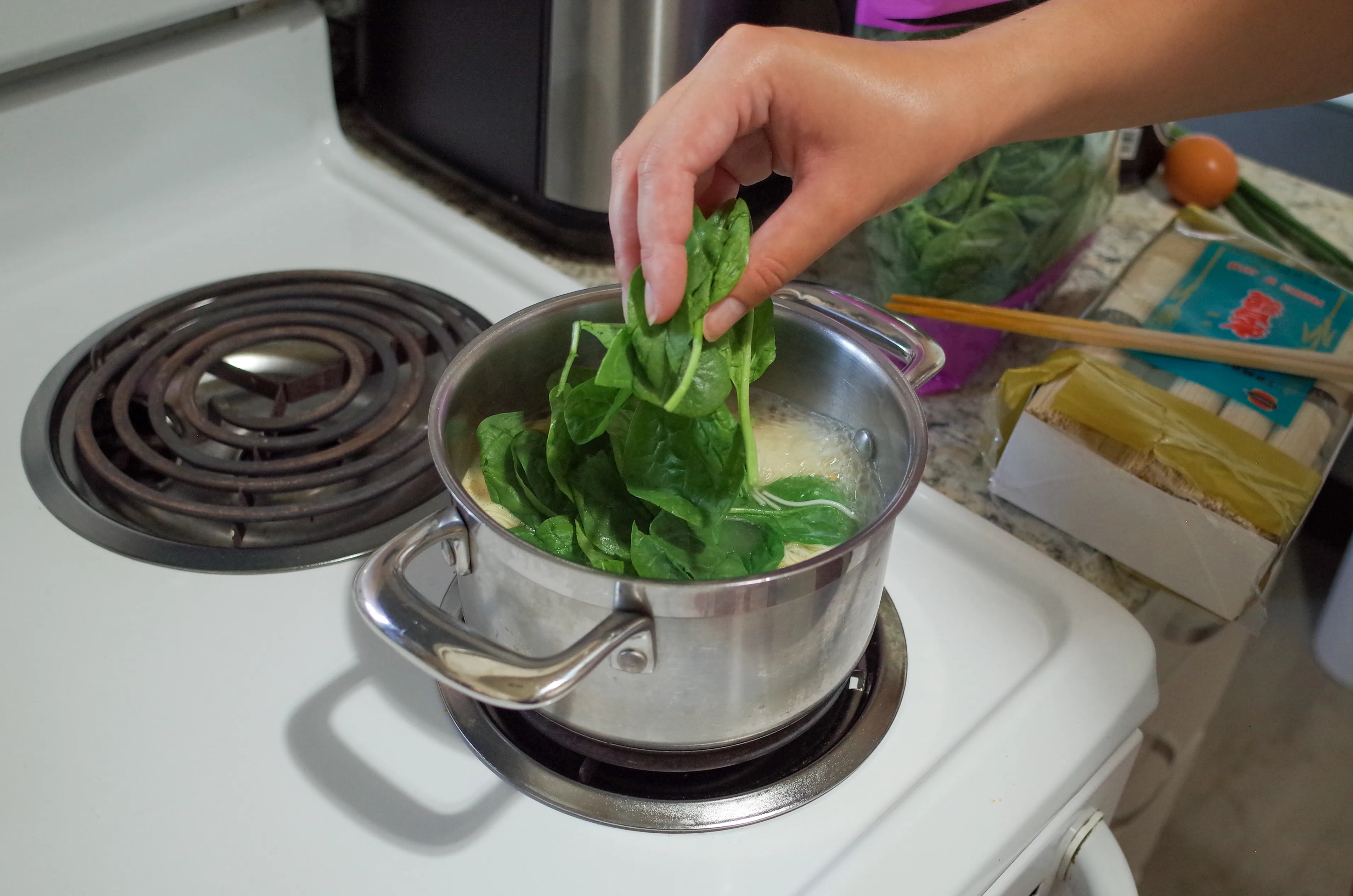 Adding spinach to pot